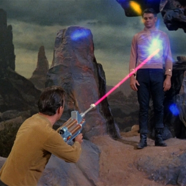 Kirk_fires_a_phaser_rifle_at_Mitchell